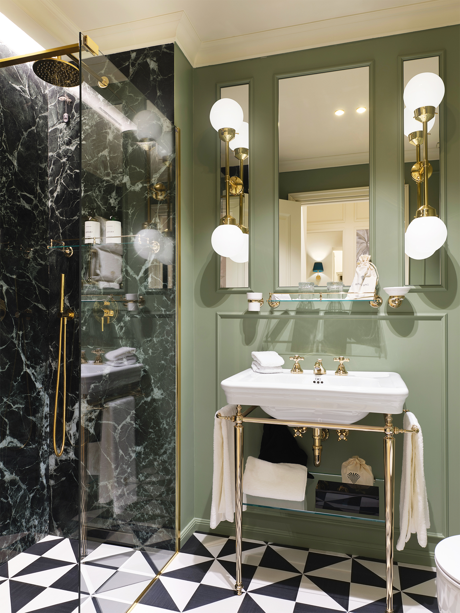 Signature Room marble bathroom with brass fittings