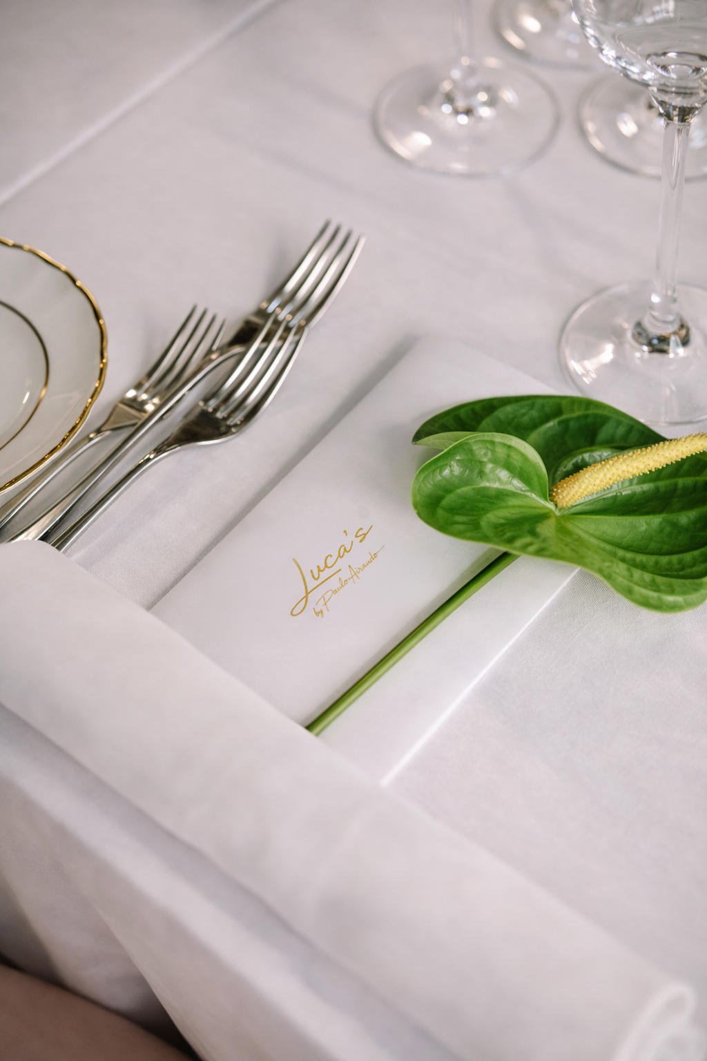 An elegantly set table at Luca's Restaurant
