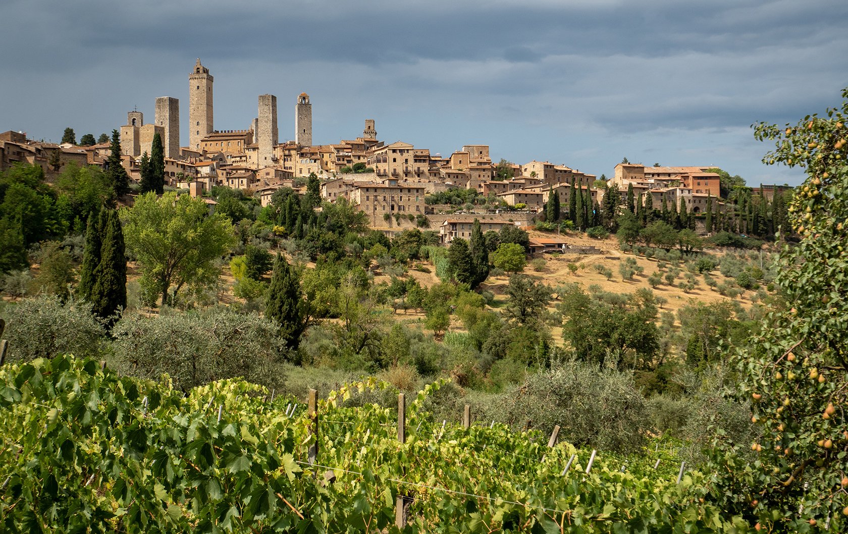 The medieval towers of San Gimignano above the Tuscan hills